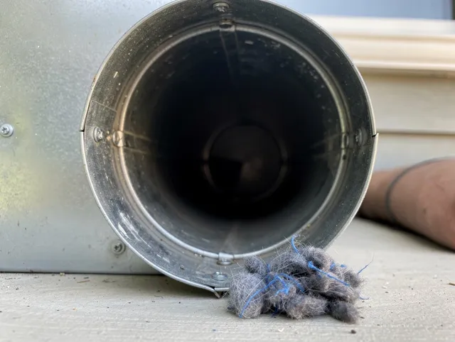 Wethersfield Dryer Vent Cleaning technician using specialized equipment to clear severe dryer vent blockage in Wethersfield